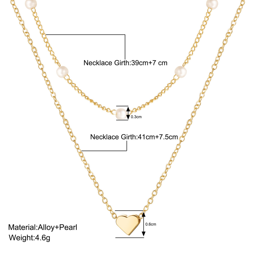 Damen Halskette mit eleganten Perlen und zarten Herzanhängern Shop Nory