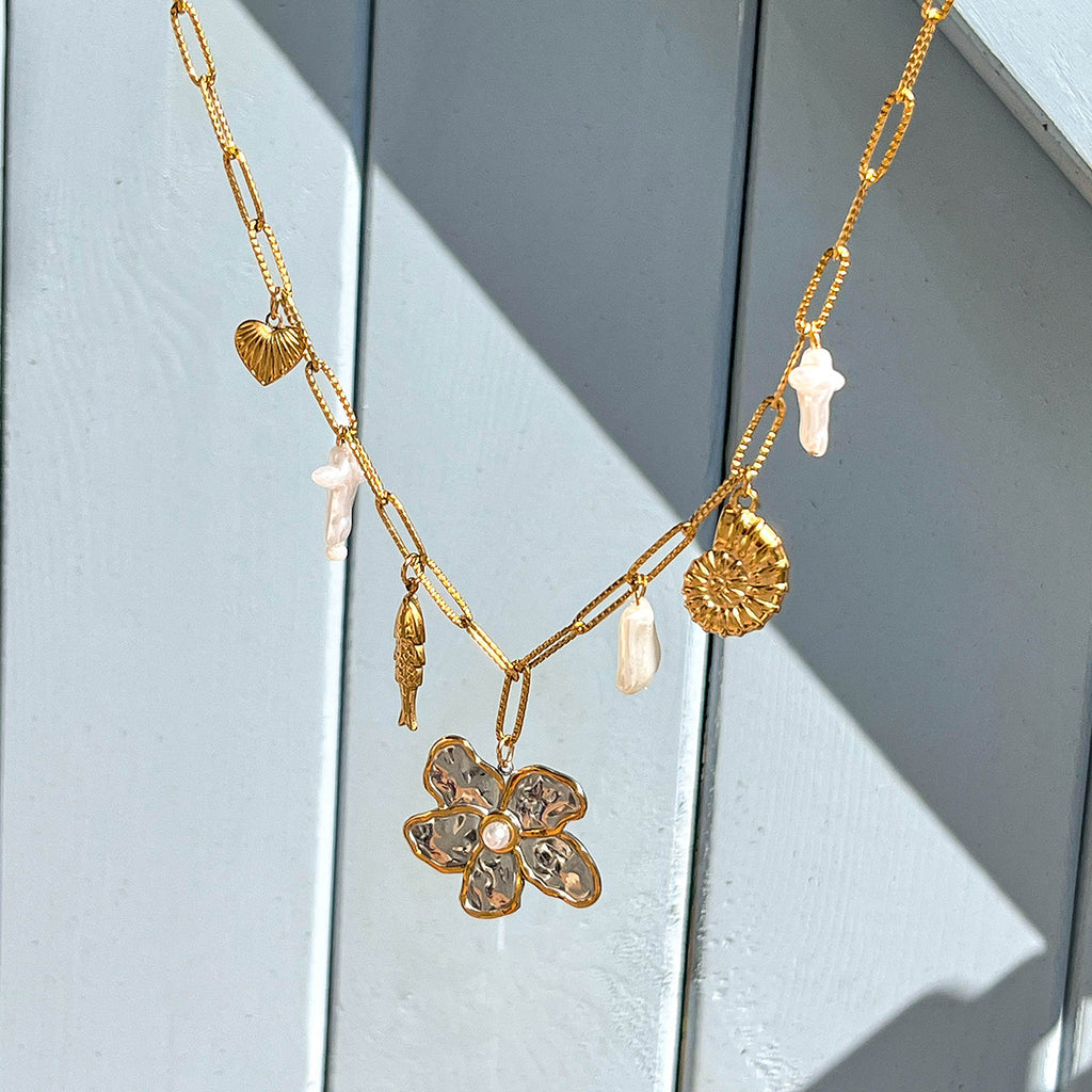 Damen Halskette mit blütenförmigem Anhänger aus hypoallergenem Edelstahl und eleganter Gliederkette Shop Nory