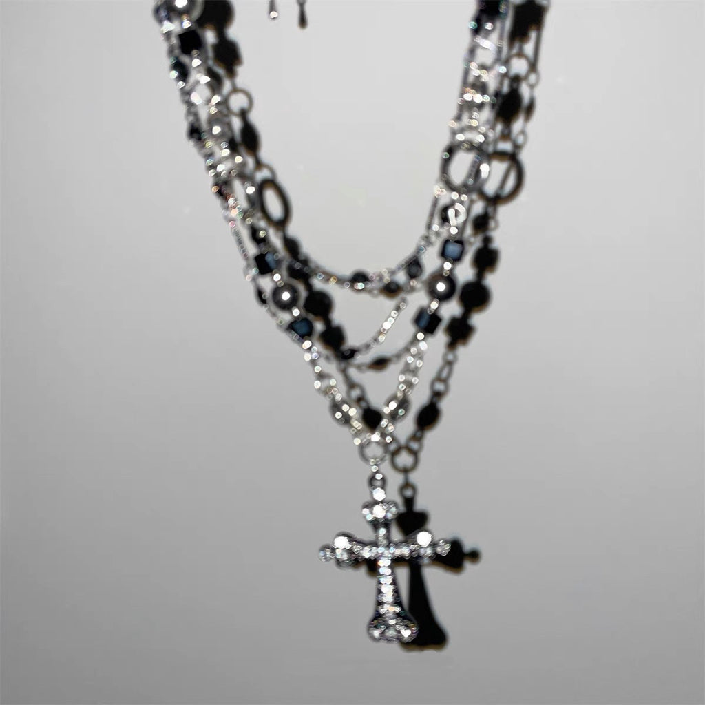Damen mehrlagige Kette mit funkelndem Kreuzanhänger und eleganten Gliederkettendetails Shop Nory