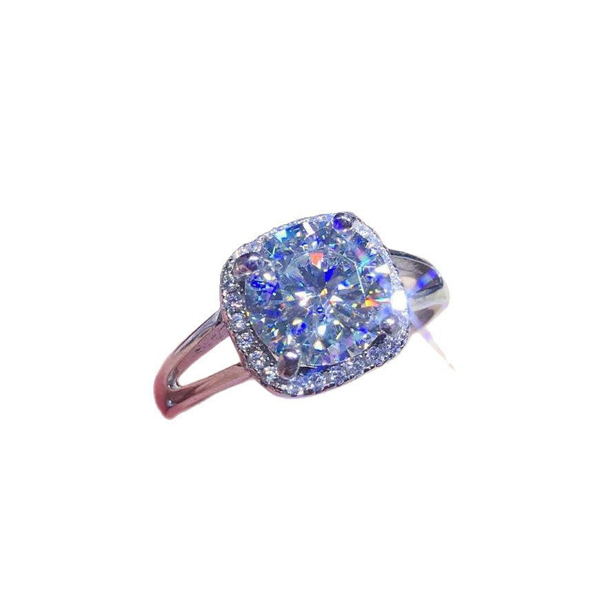 Damen eleganter Schmuckring mit quadratischem Hauptstein und funkelndem Zirkonia-Rahmen Shop Nory