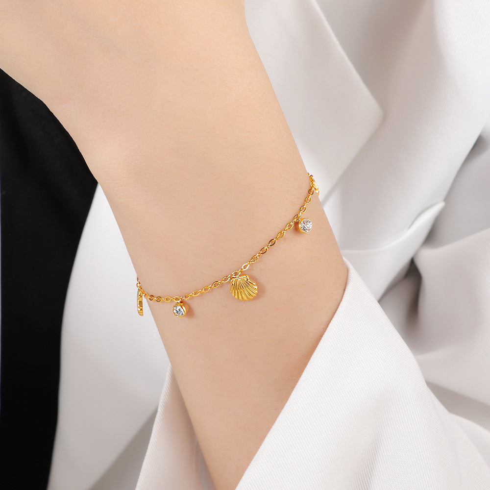 Damen zierliches Armband mit Muschel-Design und funkelndem Kristall Shop Nory