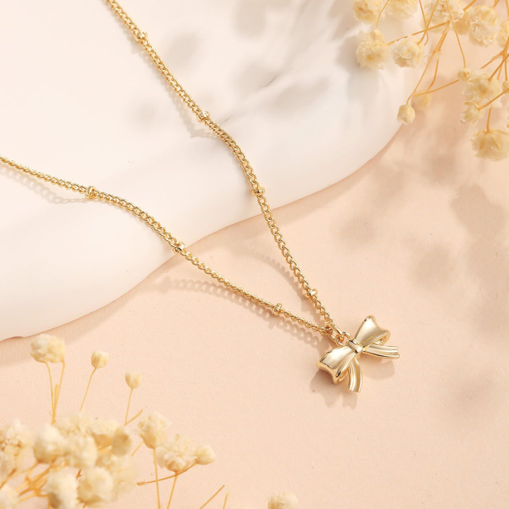 Damen Halskette mit elegantem Schleifenanhänger und feinem Kettendesign Shop Nory