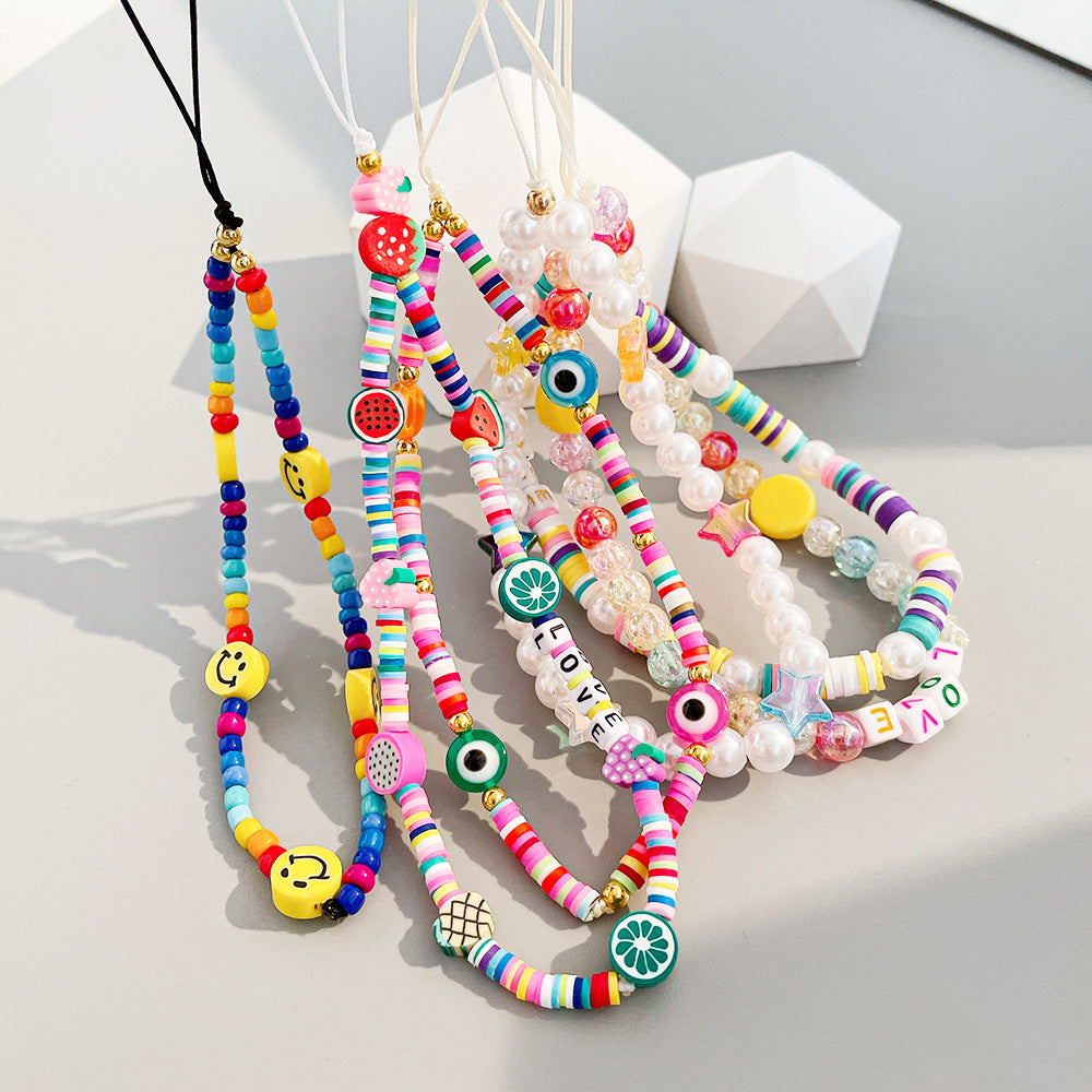 Damen farbenfrohe Schmuck-Halskette mit Smiley und Buchstabenanhängern Shop Nory
