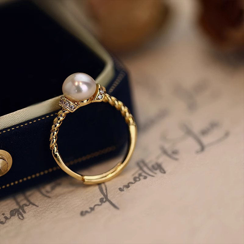 Damen eleganter Ring mit kunstvoll geflochtenem Design und edler Perle Shop Nory