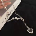 Damen Kette mit eleganten Perlen-Details und funkelndem Herzanhänger Shop Nory