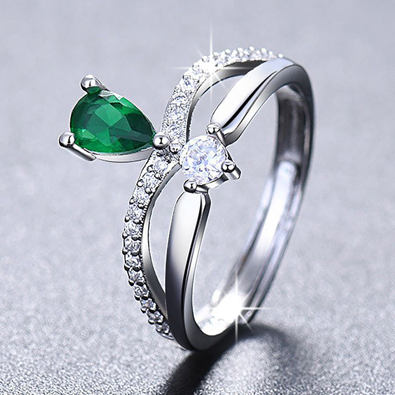 Damenring mit elegantem, tropfenförmigem Edelsteinbesatz und Zirkonia-Details Shop Nory