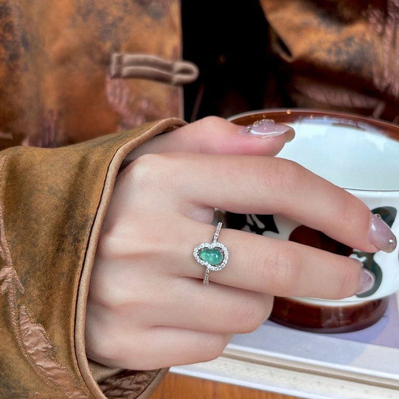 Damen eleganter Ring mit ovalem Zirkonia und funkelndem Rahmen Shop Nory