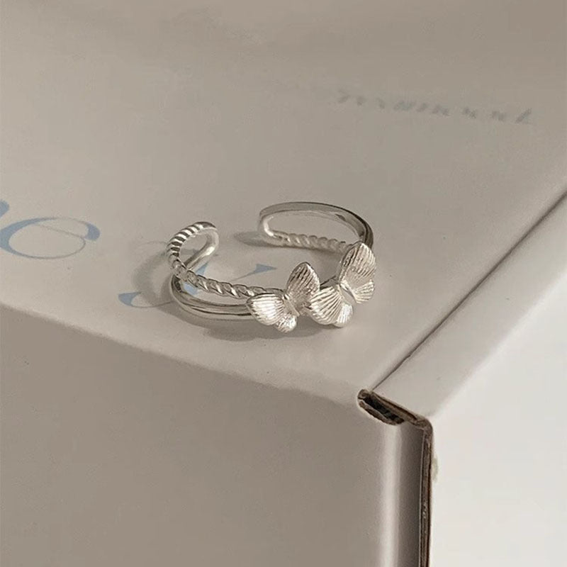 Damenring mit filigranem Schmetterlingsmotiv und romantischem Design Shop Nory