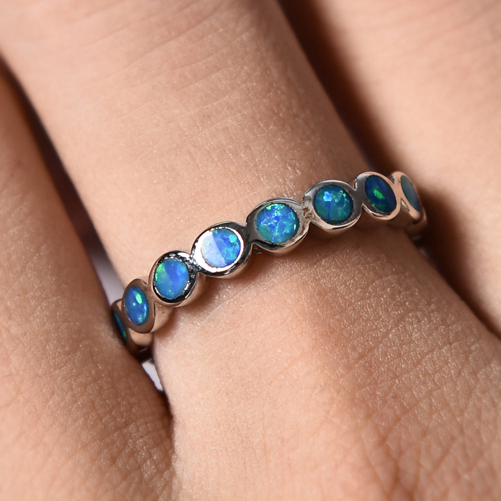 Damen Ring mit schillernden Opalsteinen und eleganter Edelstahlfassung Shop Nory