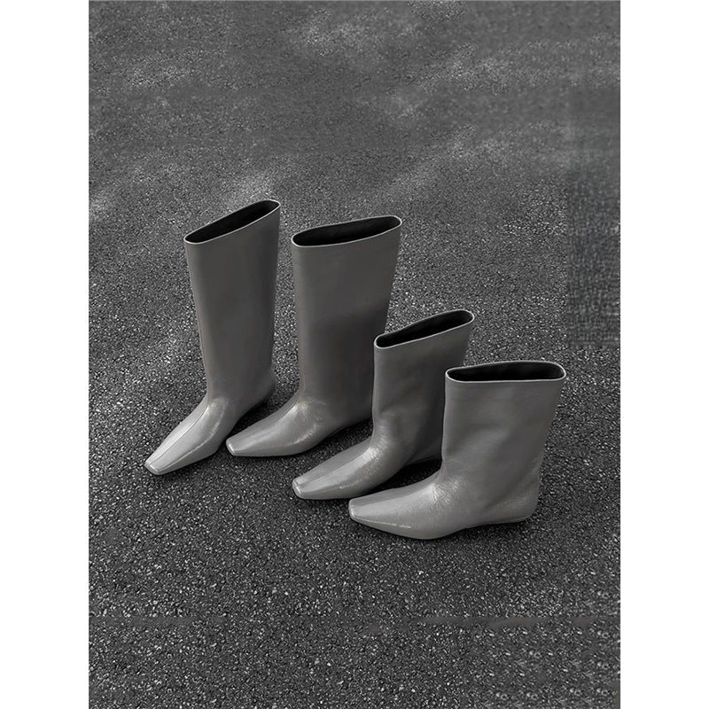 Damen kniehohe Slouch‑Lederstiefel mit quadratischer Zehenform und flachem Absatz Shop Nory