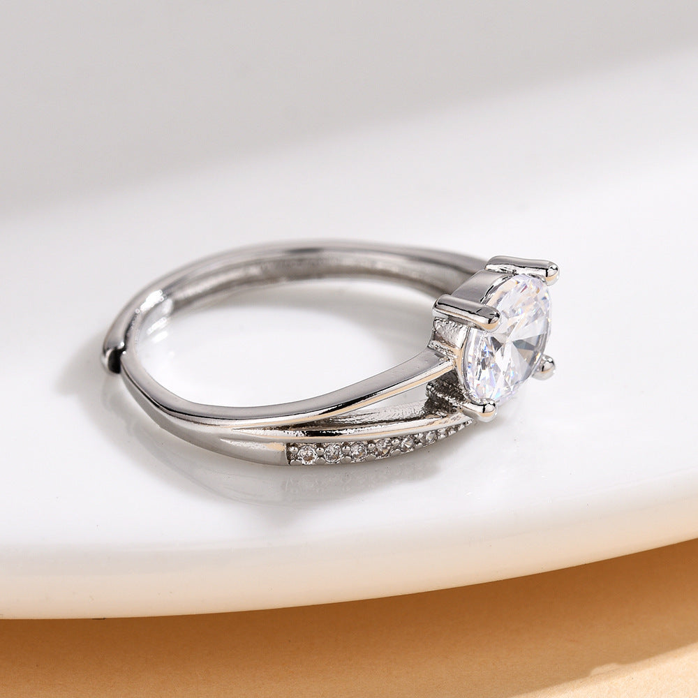 Damen eleganter Solitärring mit geschwungenem Design und funkelndem Zirkonia Shop Nory