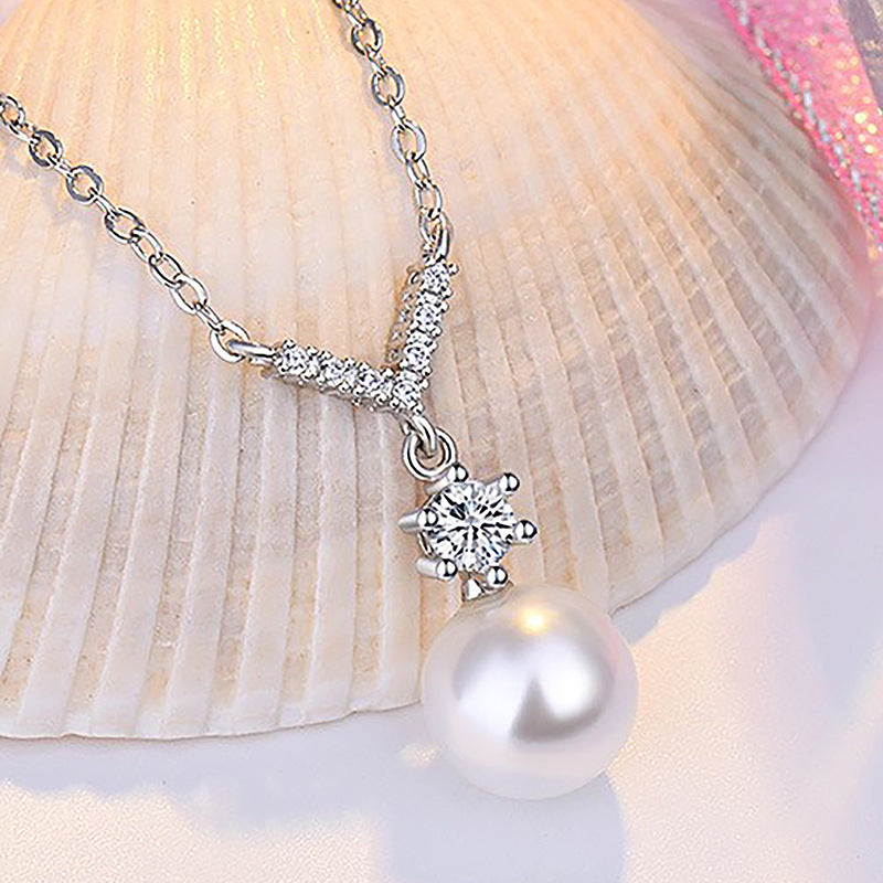 Damen Halskette mit funkelndem Zirkonia-Anhänger und eleganter Perle Shop Nory