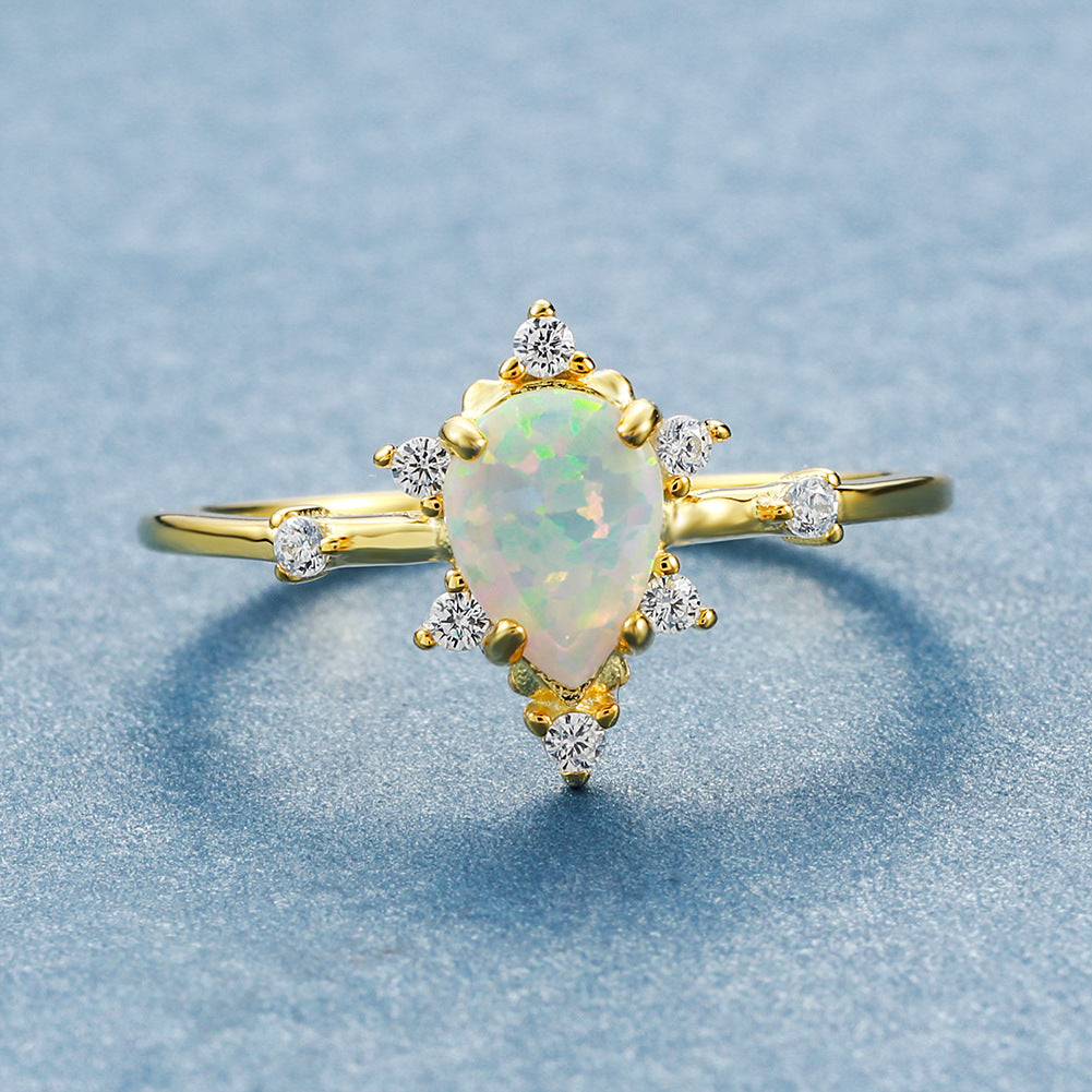 Damen Ring mit funkelndem Tropfen-Opal und elegantem Zirkonia-Design Shop Nory