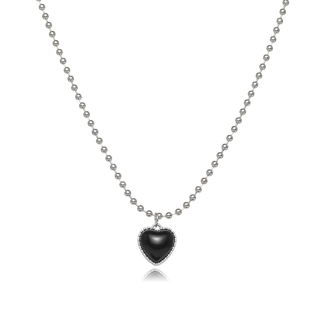 Damen Halskette mit herzförmigem Anhänger und funkelnden Details Shop Nory
