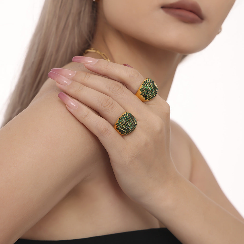 Damenring mit elegantem, goldbeschichtetem Design und Türkissteinbesatz Shop Nory