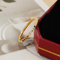 Damen schimmernder Armreif mit bunten Steinen Shop Nory
