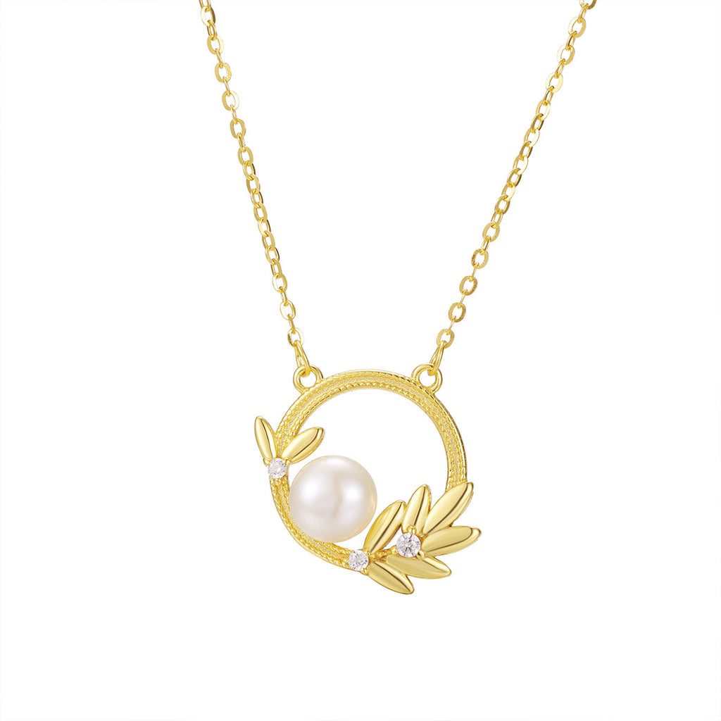 Damen Halskette mit elegantem Perlenelement und filigranem Blätter-Design Shop Nory