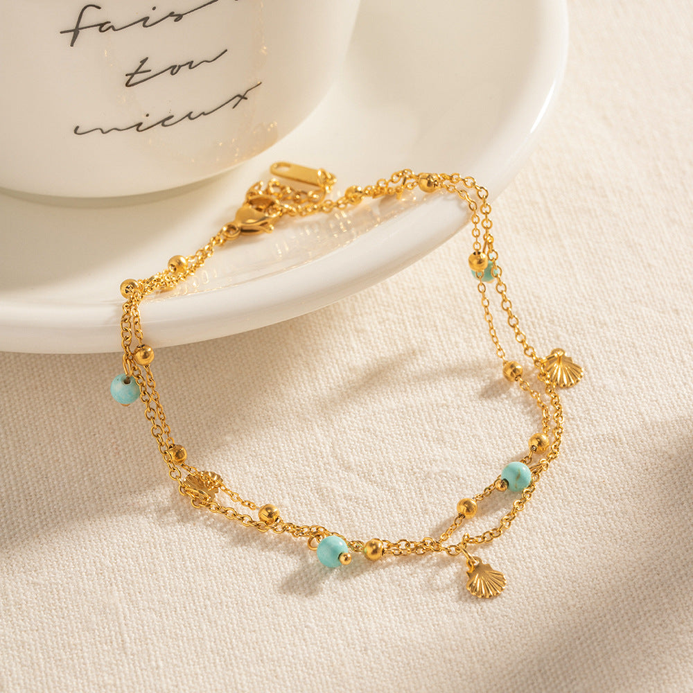 Damen elegantes Armband mit Muschel- und Quarz-Details Shop Nory