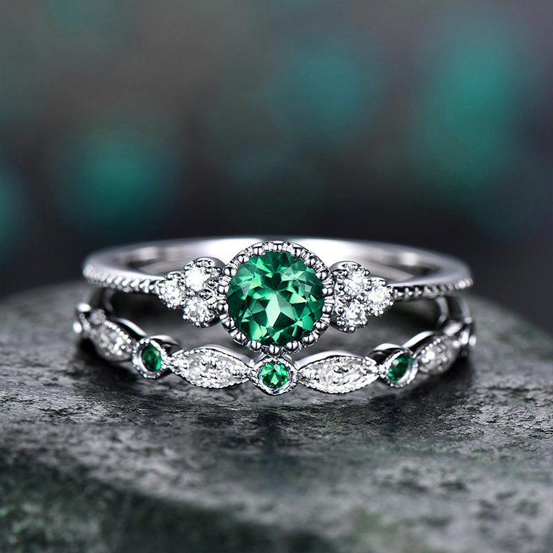 Damen glamouröser Ring mit grünem Edelstein und feinen Zirkoniasteinen Shop Nory