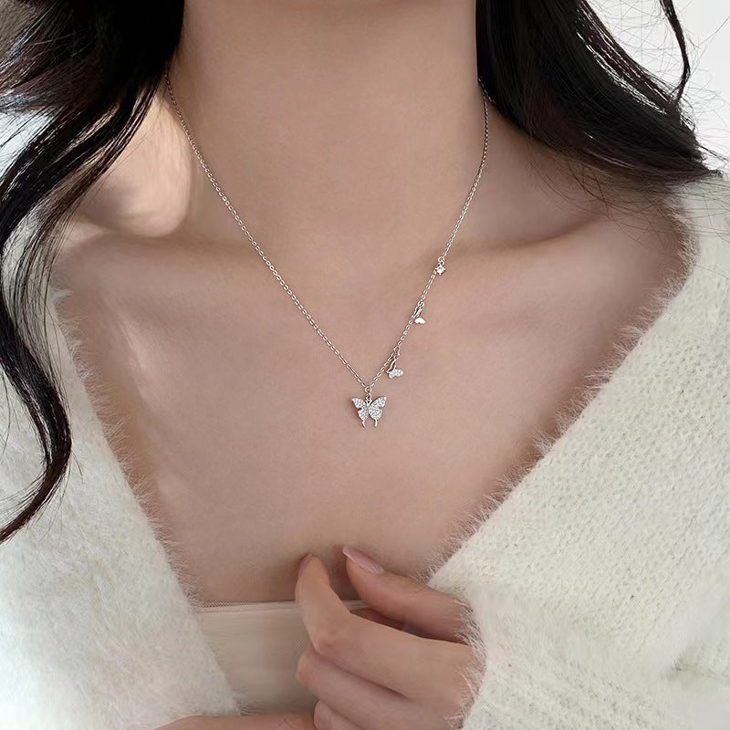 Damen Halskette mit filigranem Schmetterlingsdesign und funkelnden Zirkonia Shop Nory