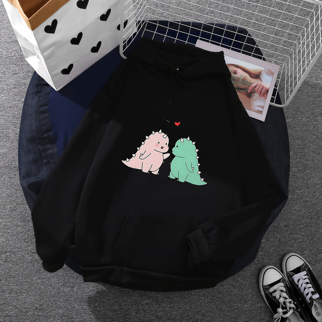 Damen nan Kapuzenpullover mit niedlicher Dinosaurierpärchen‑Illustration, Oversize‑Schnitt und Kängurutasche Shop Nory