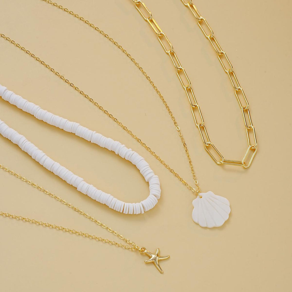 Damen mehrschichtige Halskette mit stilvollen Muschel-Anhängern und goldenen Ketten Shop Nory