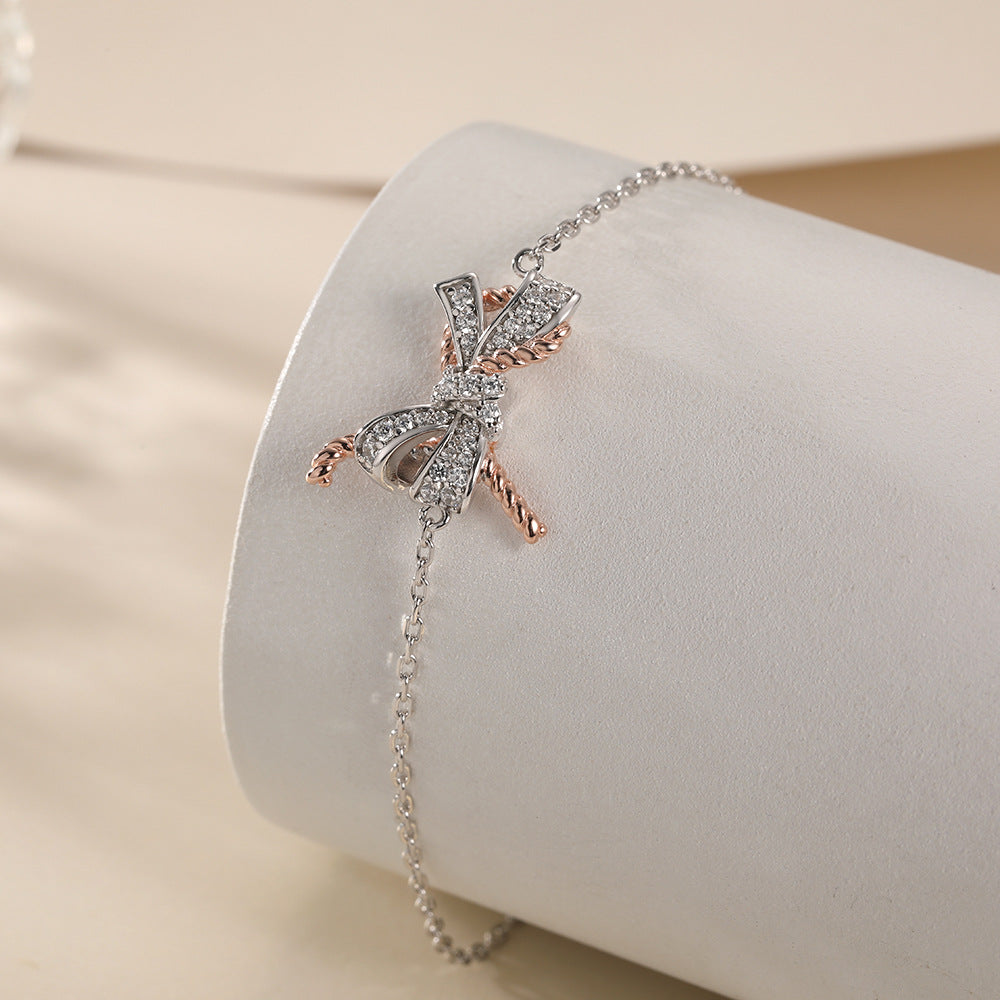 Damenarmband mit funkelndem Schleifenmotiv und Zirkonia-Besatz Shop Nory