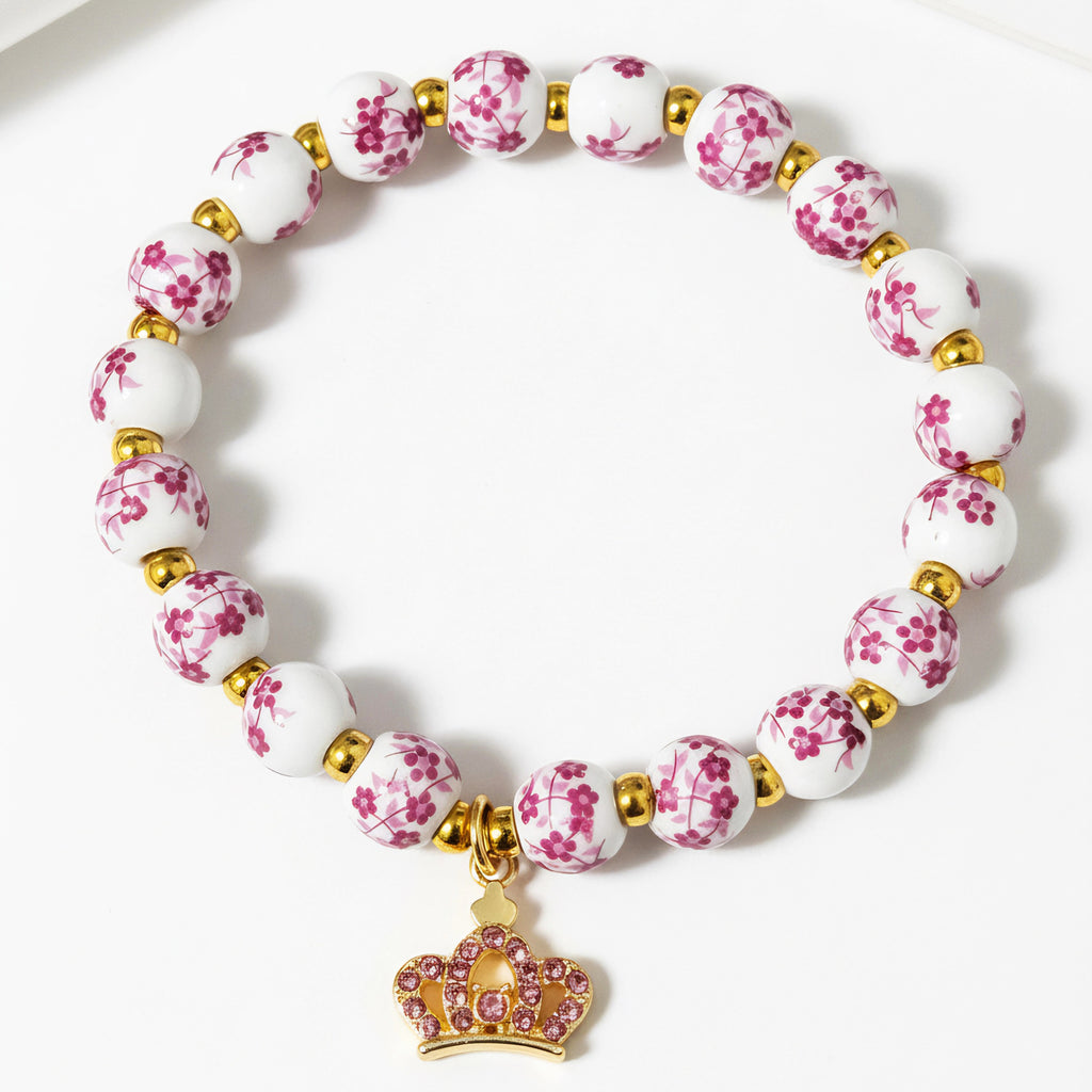 Damenarmband mit floralem Design und goldenen Akzenten Shop Nory