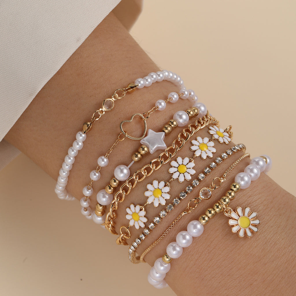 Damen Armband-Set mit stilvollen Perlen und bunten Blumenanhängern Shop Nory