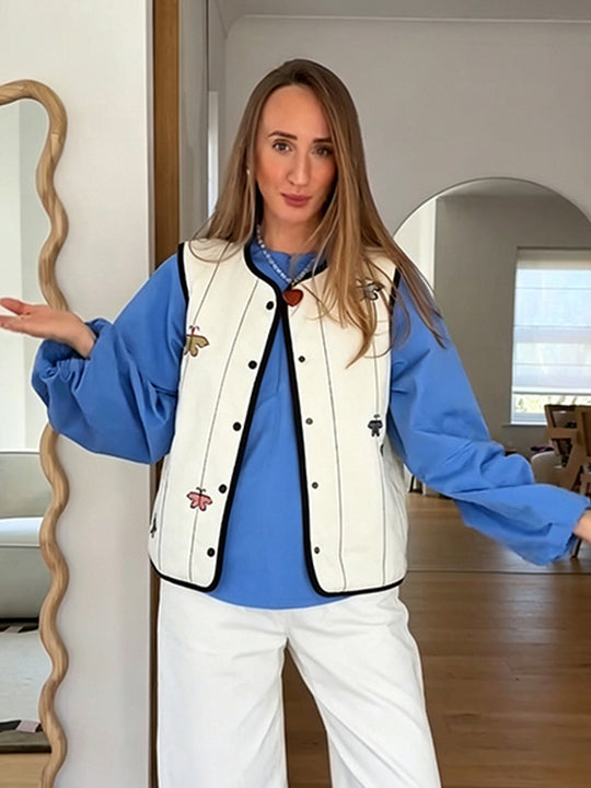 Damen Steppweste mit Stickmotiven, kontrastierter Paspel und Druckknopfverschluss Shop Nory
