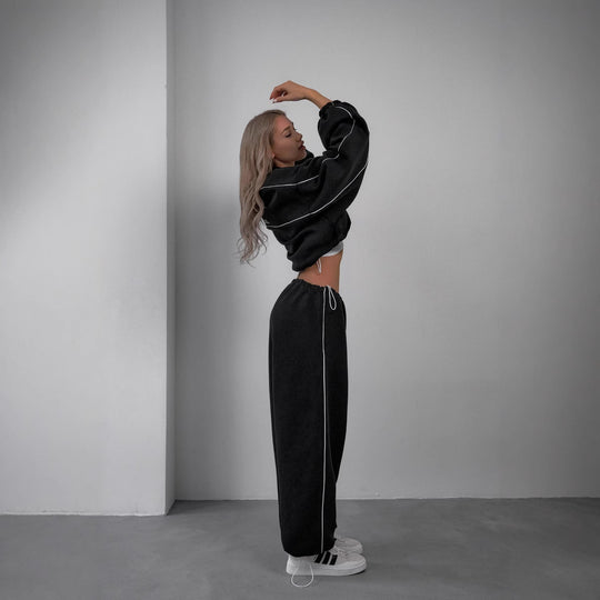 Damen cropped Zip-Kapuzenjacke mit Tunnelzug-Bund, oversized Ärmeln und kontrastierender Paspel Shop Nory