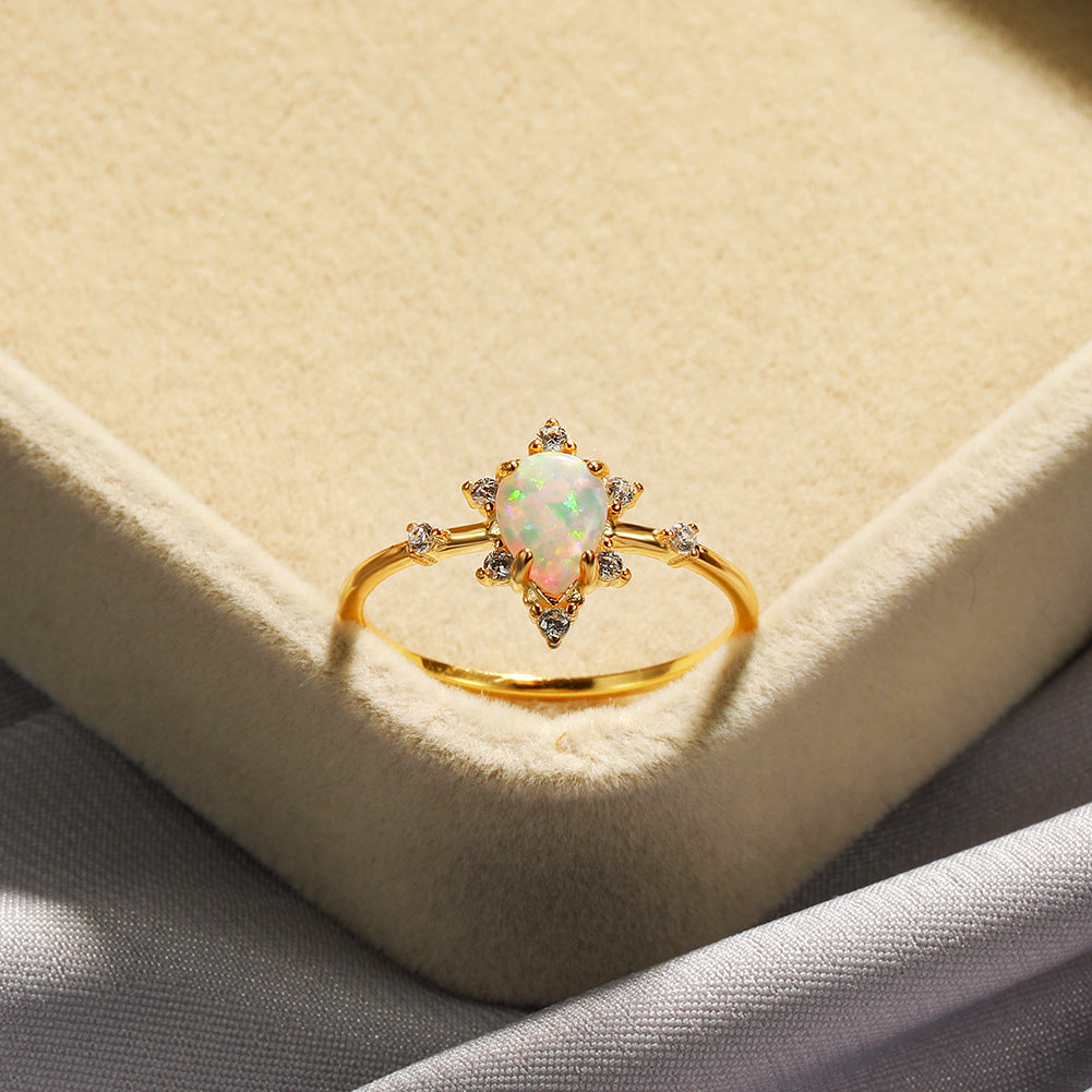 Damen Ring mit funkelndem Tropfen-Opal und elegantem Zirkonia-Design Shop Nory