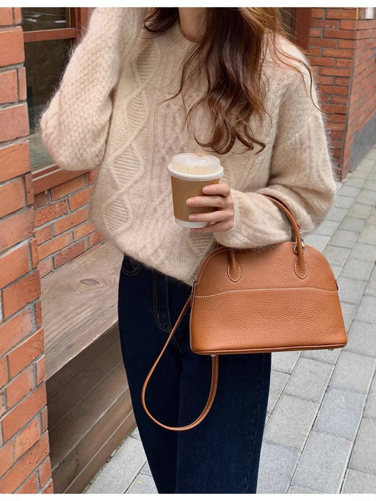 Damen strukturierte Leder‑Handtasche mit abnehmbarem Schulterriemen und gerundeter Korpusform Shop Nory