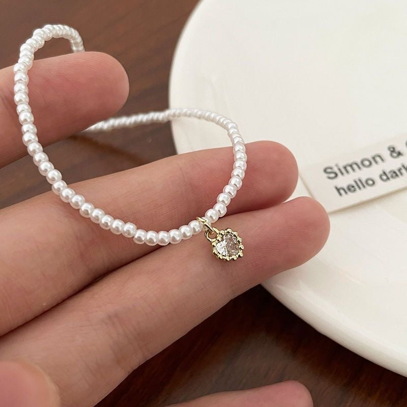 Damen Perlenarmband mit luxuriösem Herzanhänger Shop Nory