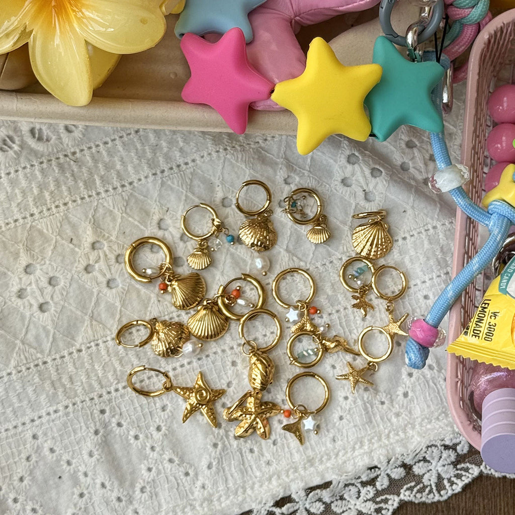 Damen Goldene Ohrringe mit Muschel-Design und Zirkonia Akzenten Shop Nory