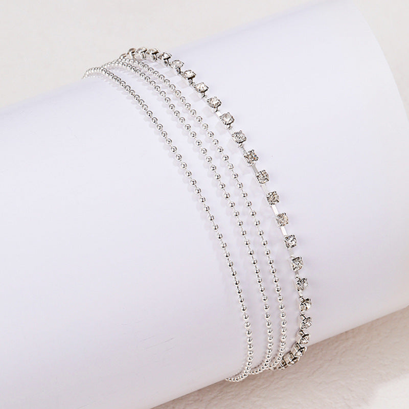 Damen Fußkettchen mit funkelnden Zirkonia und eleganter Gold-Oberfläche Shop Nory
