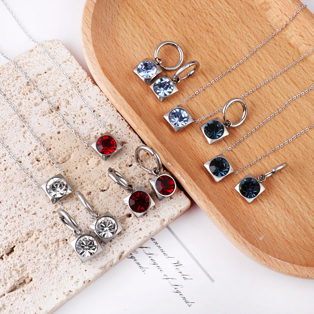 Damen zartes Schmuckset mit rundem Zirkonia-Anhänger und Edelstahlohrringen Shop Nory