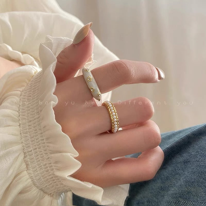 Damen Ring mit filigranem Perlendesign und elegantem Goldfinish Shop Nory