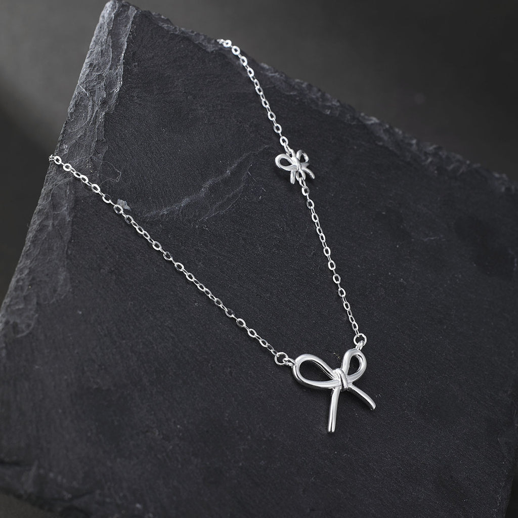 Damen Halskette mit kunstvollem Schleifenanhänger und feiner Gliederkette Shop Nory