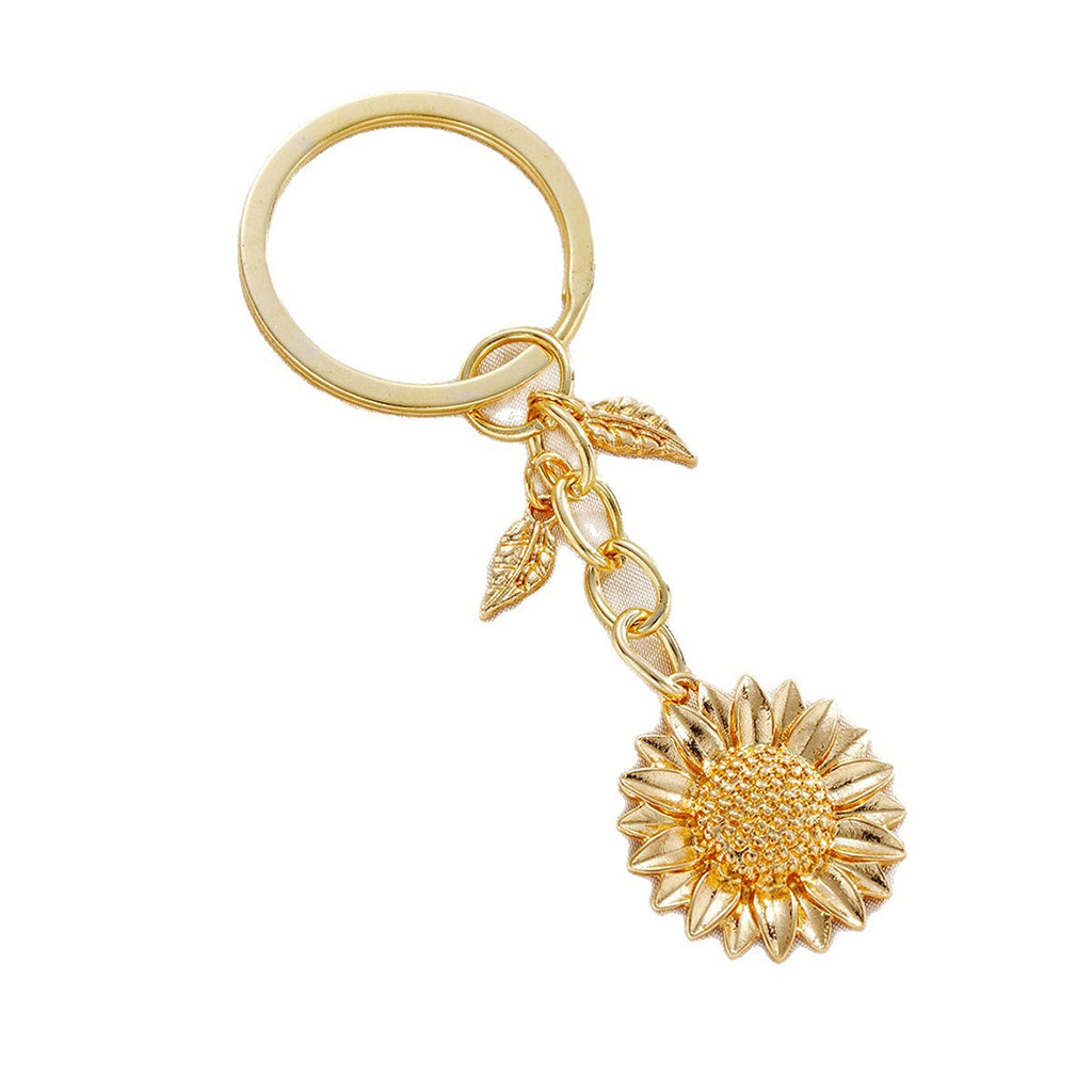 Damen Schlüsselanhänger mit filigranem Sonnenblumen-Design und elegantem Blattakzent Shop Nory