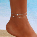 Damen Fußkettchen mit herzförmigen Anhängern und filigranen Details Shop Nory