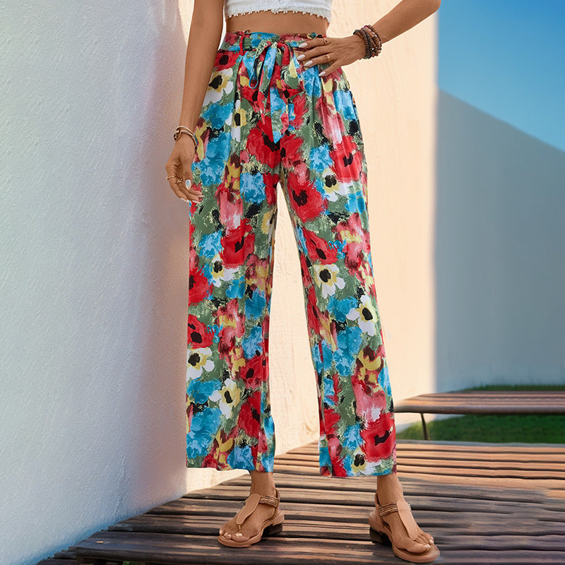 Damen Leichte High‑Waist Marlenehose mit floralem Aquarellprint, weitem Bein & Bindegürtel Shop Nory