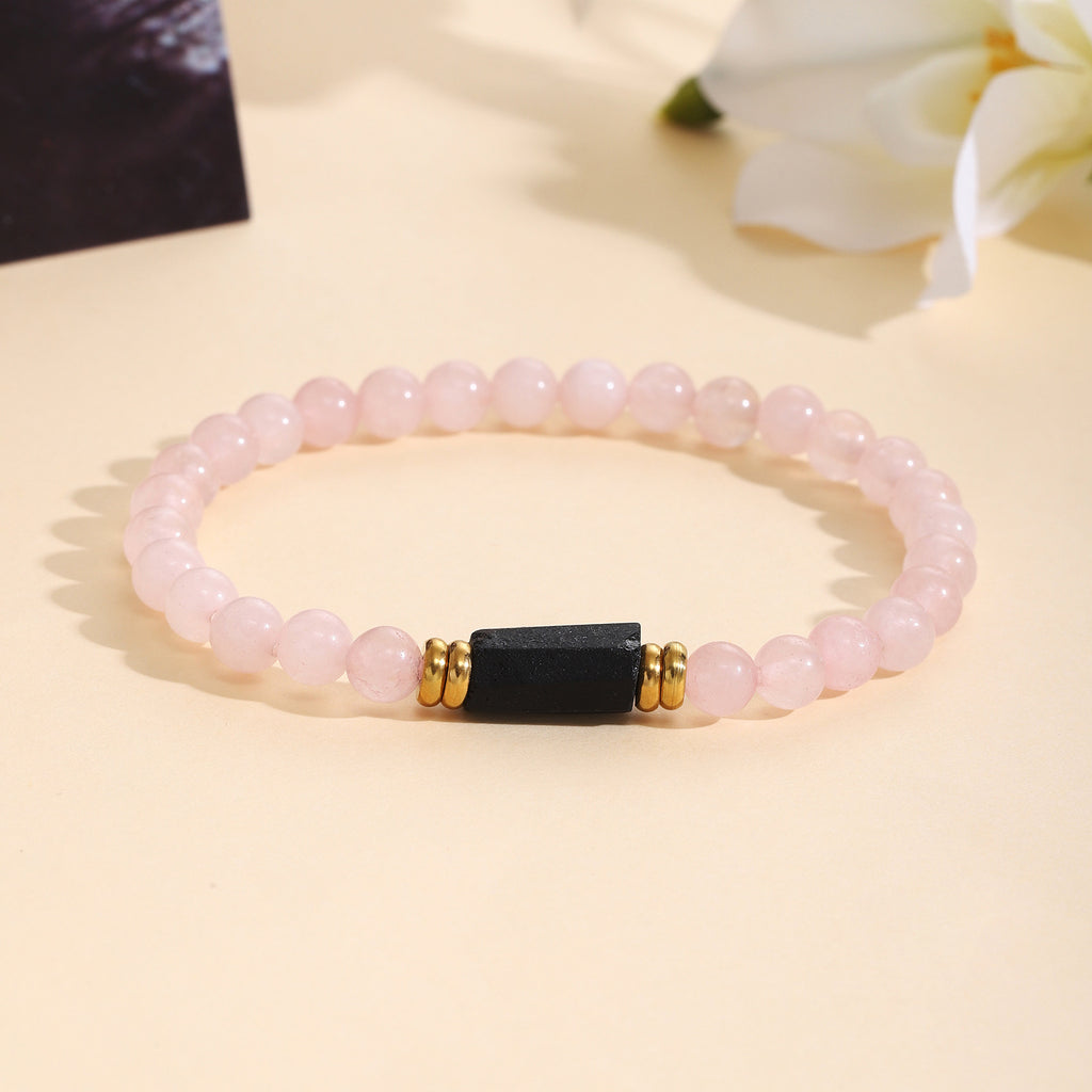 Damenarmband aus Rosenquarz mit schwarzem Akzent und goldenen Verzierungen Shop Nory
