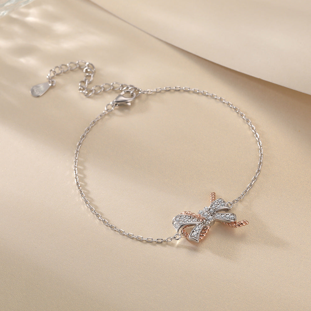 Damenarmband mit funkelndem Schleifenmotiv und Zirkonia-Besatz Shop Nory