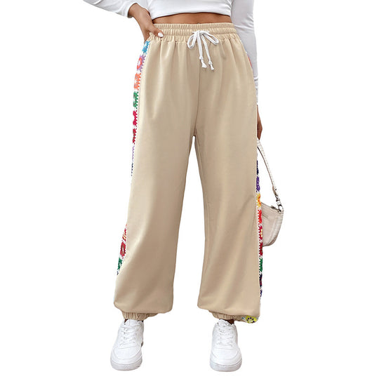 Damen Locker sitzende Jogginghose mit Gummibund, Tunnelzug und bunten Seitenstreifen Shop Nory
