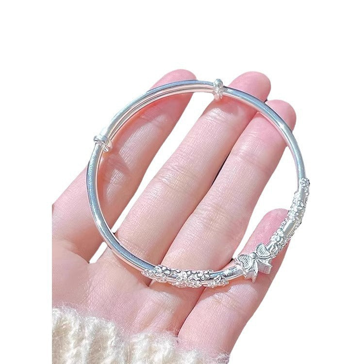 Damen Armband mit floralen und schimmernden Details Shop Nory