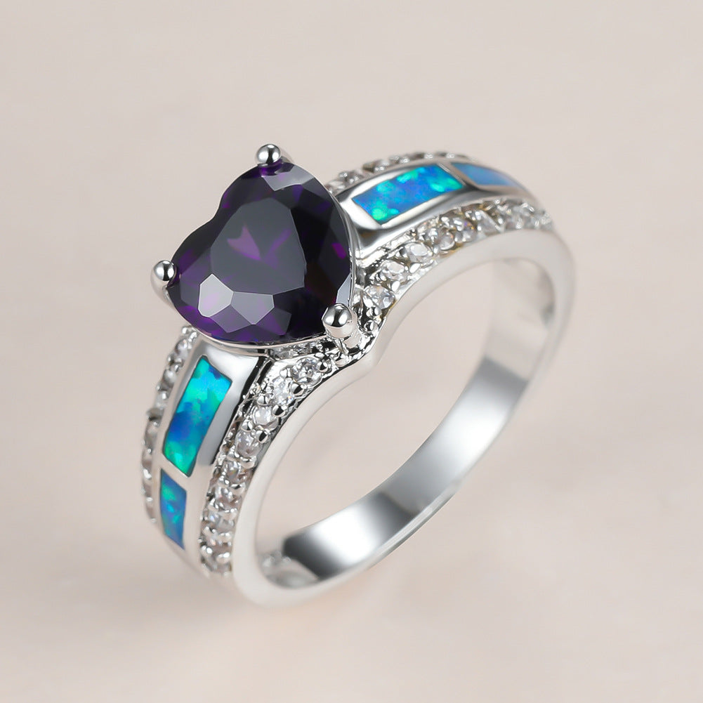 Damen Ring mit herzförmigem smaragdgrünem Stein und feinen Zirkonia-Details Shop Nory