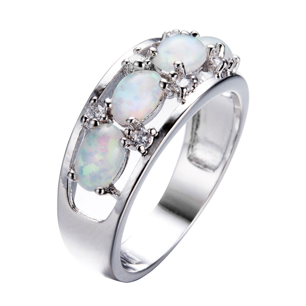 Damen Ring mit leuchtenden Opalsteinen und funkelnden Zirkonia-Elementen Shop Nory