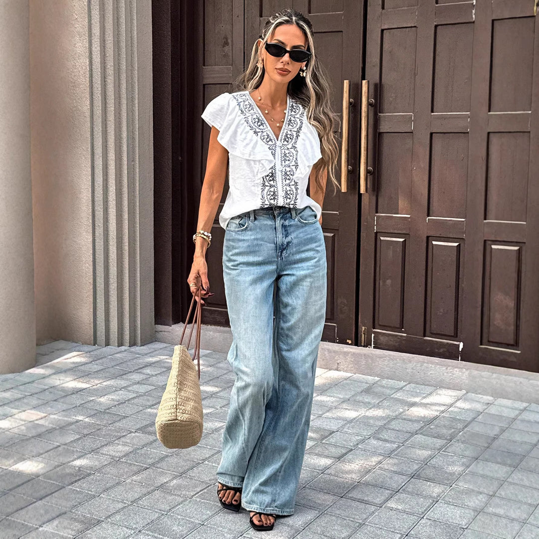 Damen Stickerei-Bluse mit V‑Ausschnitt, Knopfleiste und Volantärmeln Shop Nory