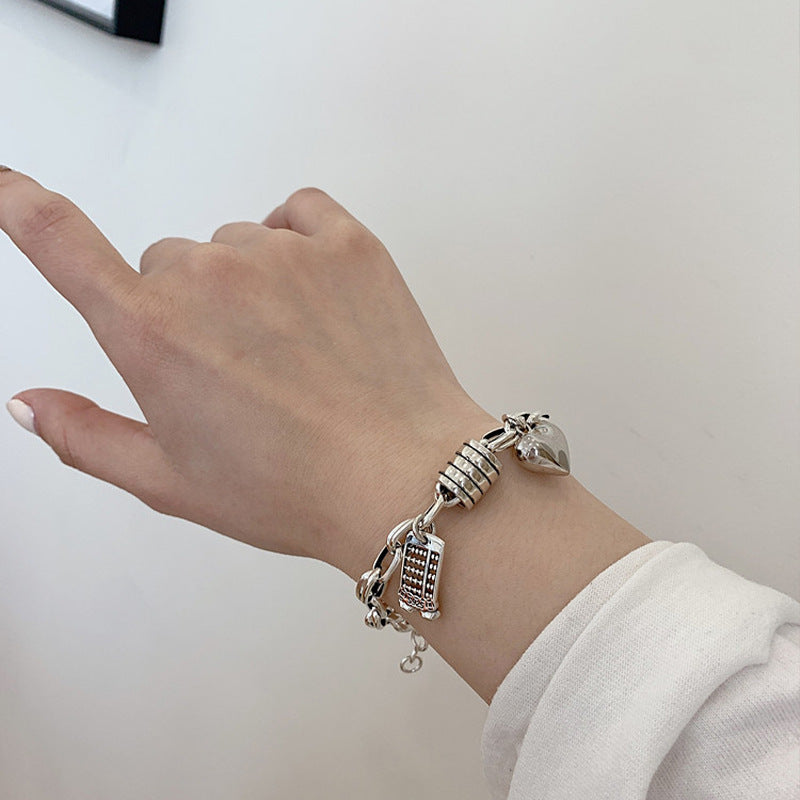 Damenarmband mit charmanten Anhängern Shop Nory